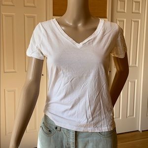 White, v-neck t-shirt.